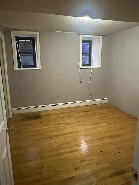 57 Brighton Avenue, Unit B Boston, MA 02134 - Photo 11 of 17 a bathroom with a tub