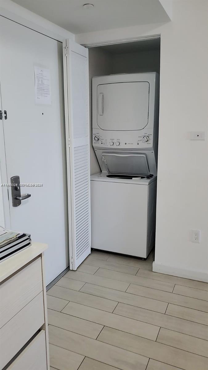 2602 East Hallandale Beach Boulevard, Unit R2508 Hallandale Beach, FL 33009 - Photo 11 of 31 a utility room with a washer and dryer