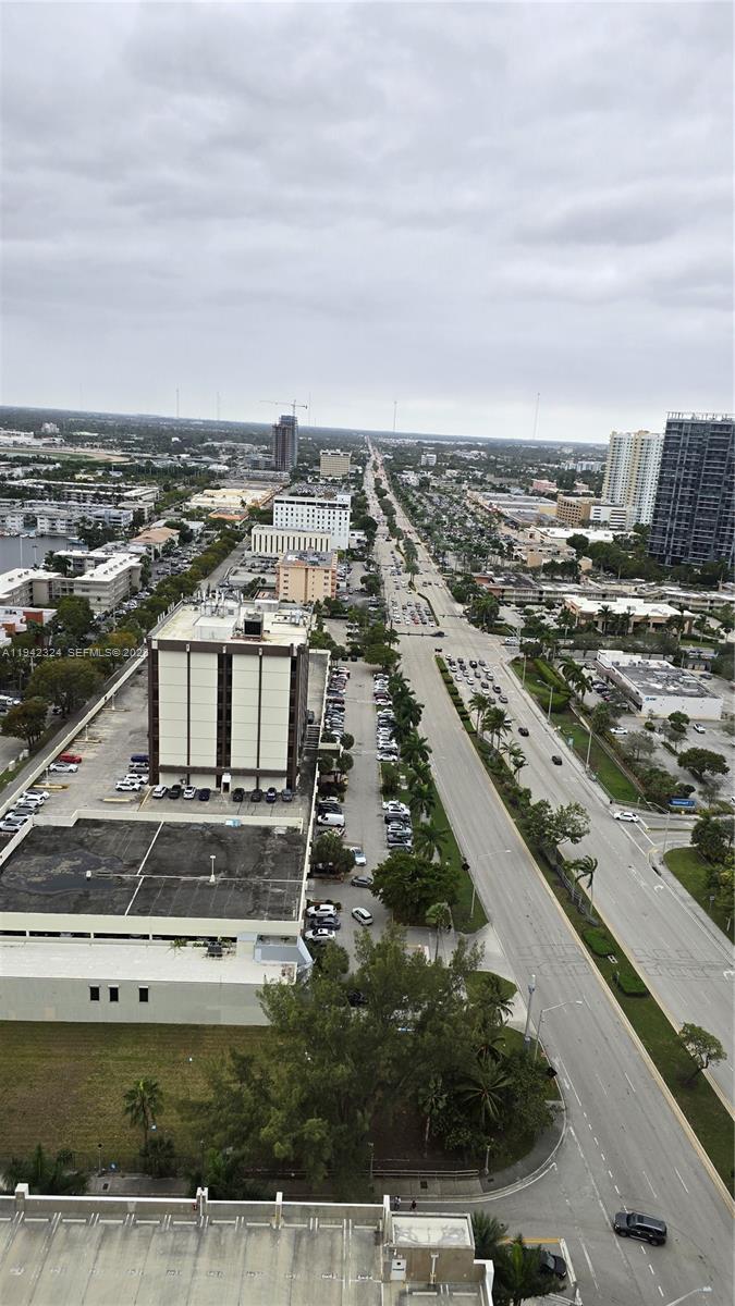 2602 East Hallandale Beach Boulevard, Unit R2508 Hallandale Beach, FL 33009 - Photo 19 of 31 an aerial view of residential houses with outdoor space
