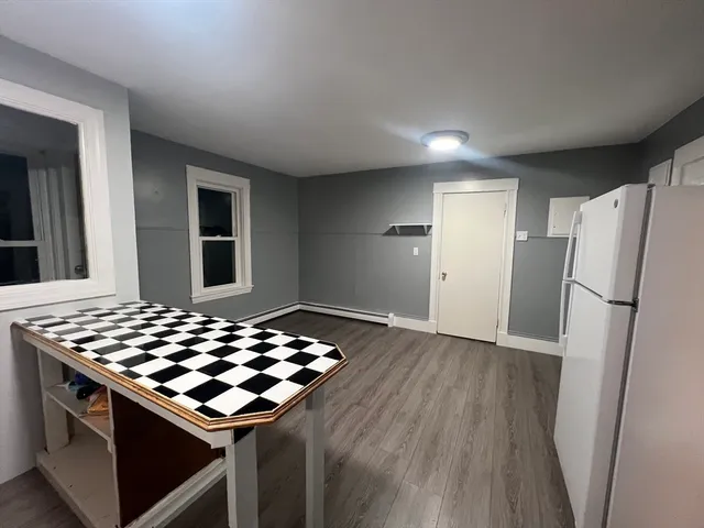 a kitchen with wooden cabinets and a stove top oven