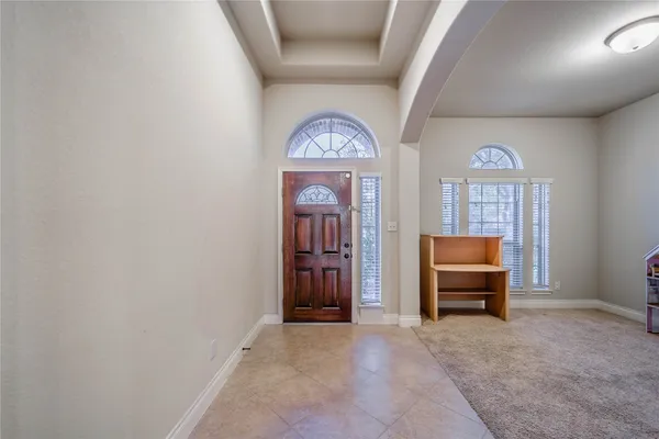 a view of a livingroom with furniture and window