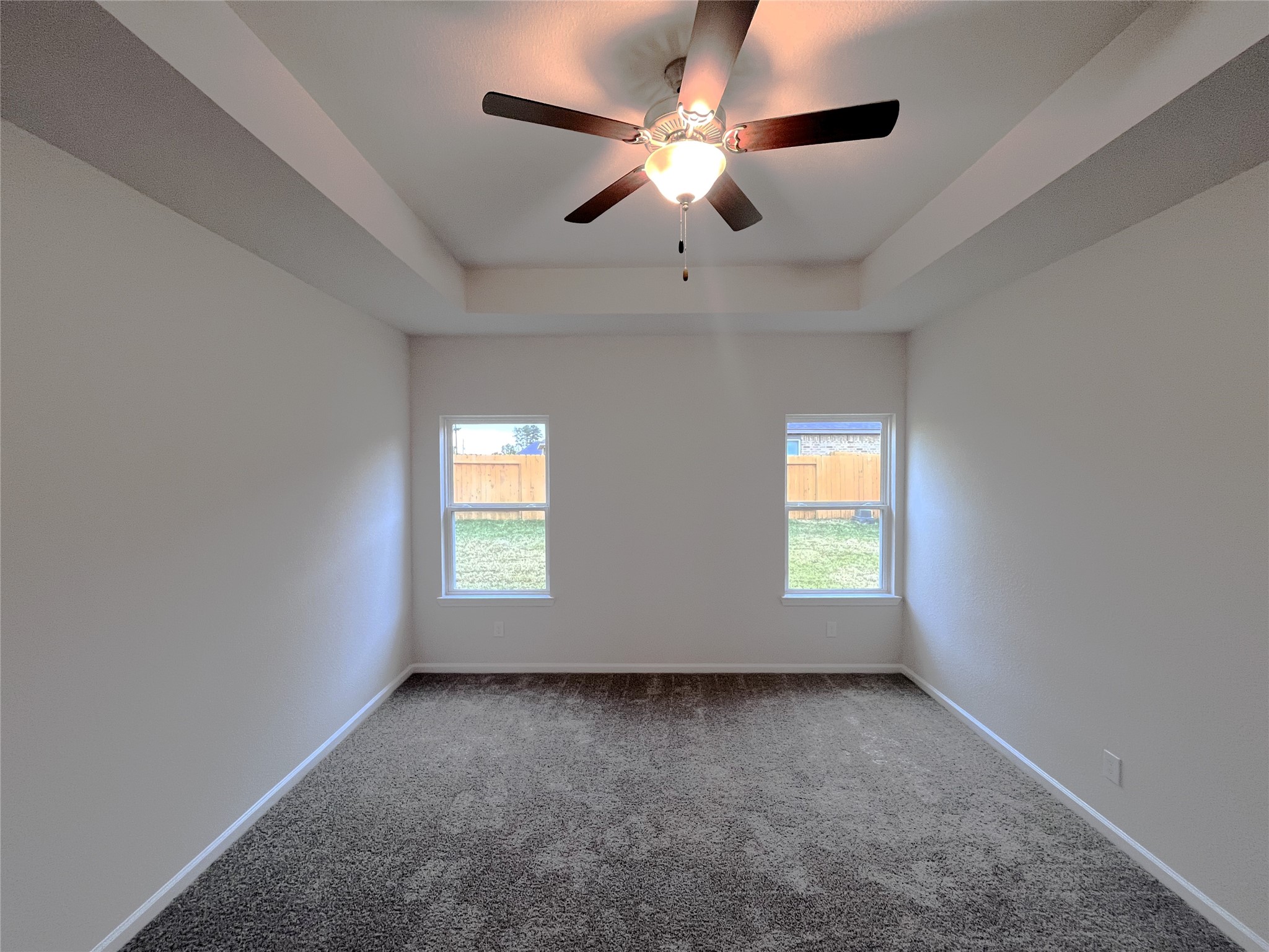 9706 Enclave Ridge Road Willis, TX 77318 - Photo 11 of 19 an empty room with windows and ceiling fan