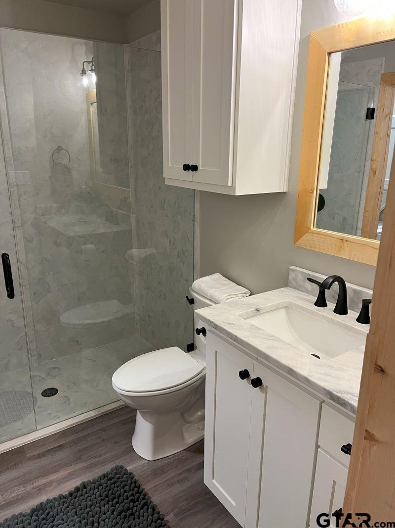 11227 Interstate 20 Tyler, TX 75708 - Photo 15 of 33 a bathroom with a sink toilet and shower