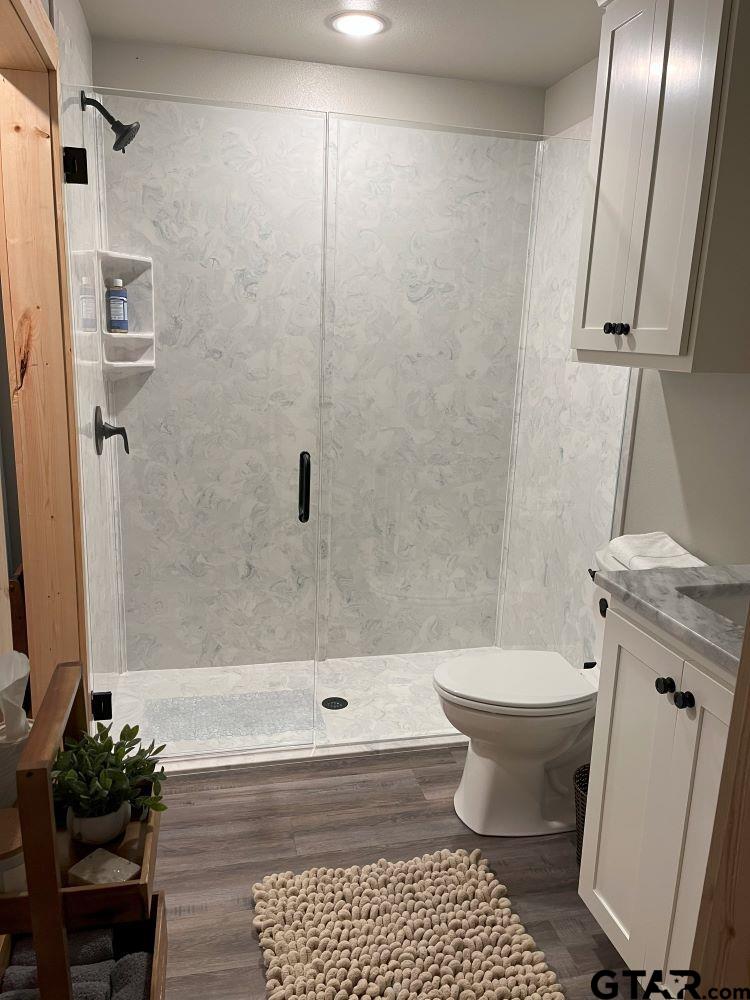 11227 Interstate 20 Tyler, TX 75708 - Photo 16 of 33 a bathroom with a sink toilet and shower