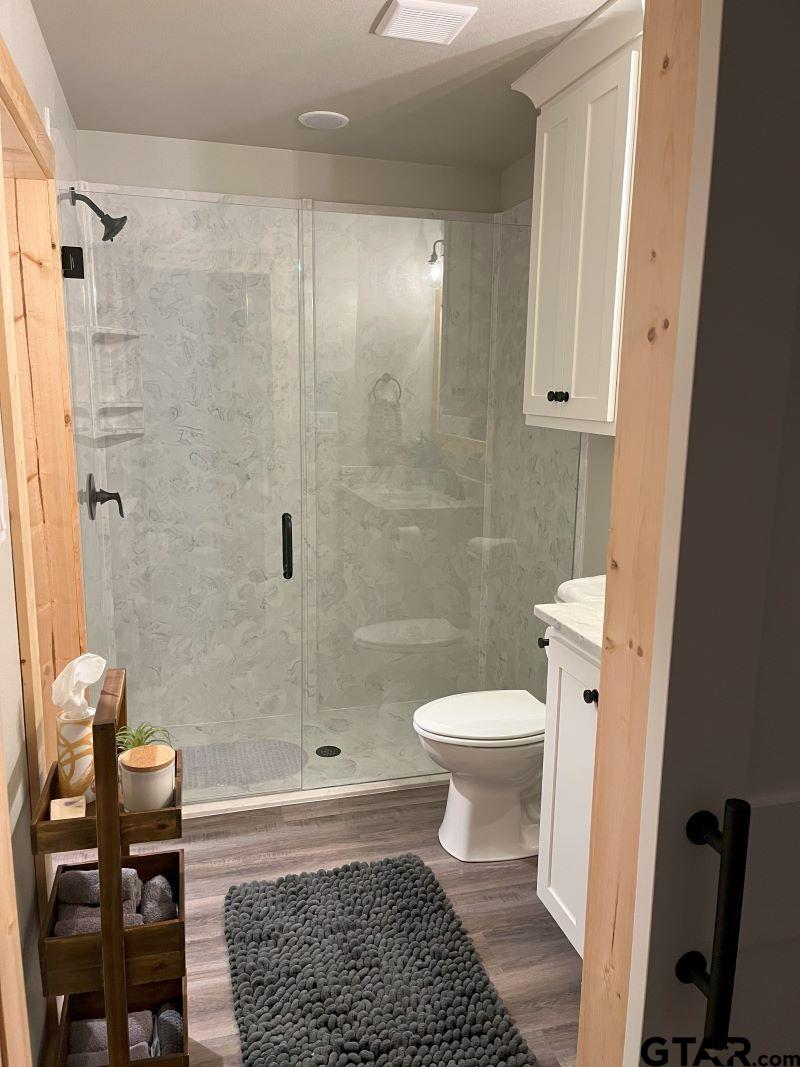 11227 Interstate 20 Tyler, TX 75708 - Photo 20 of 33 a bathroom with a toilet and a shower