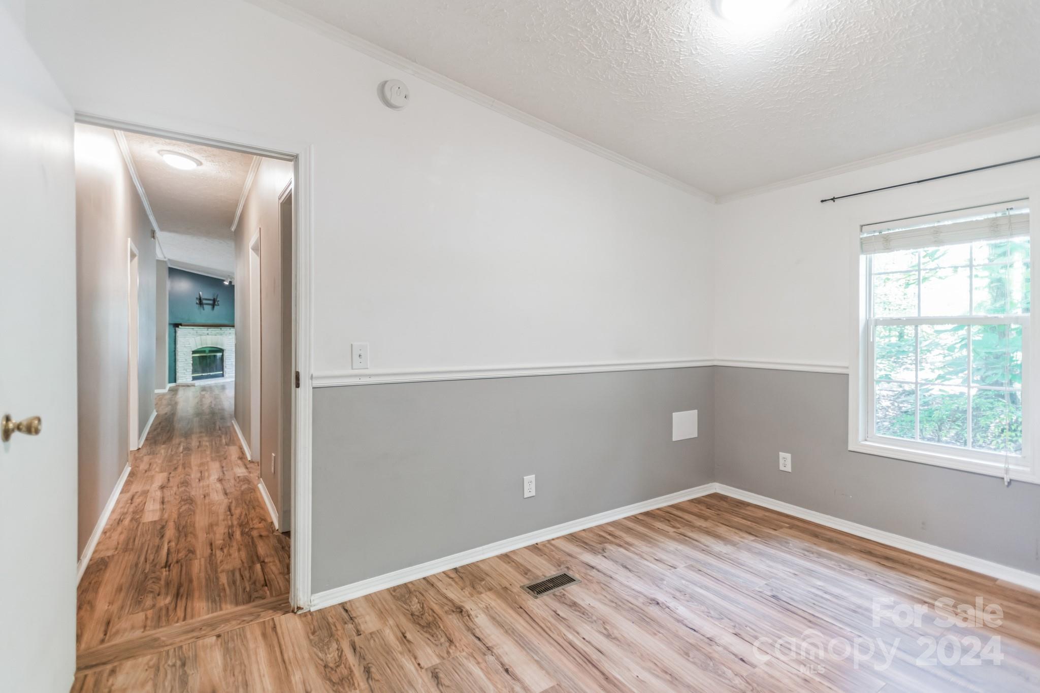 104 Cane Crest Circle Fairview, NC 28730 - Photo 17 of 29 wooden floor in an empty room with a window