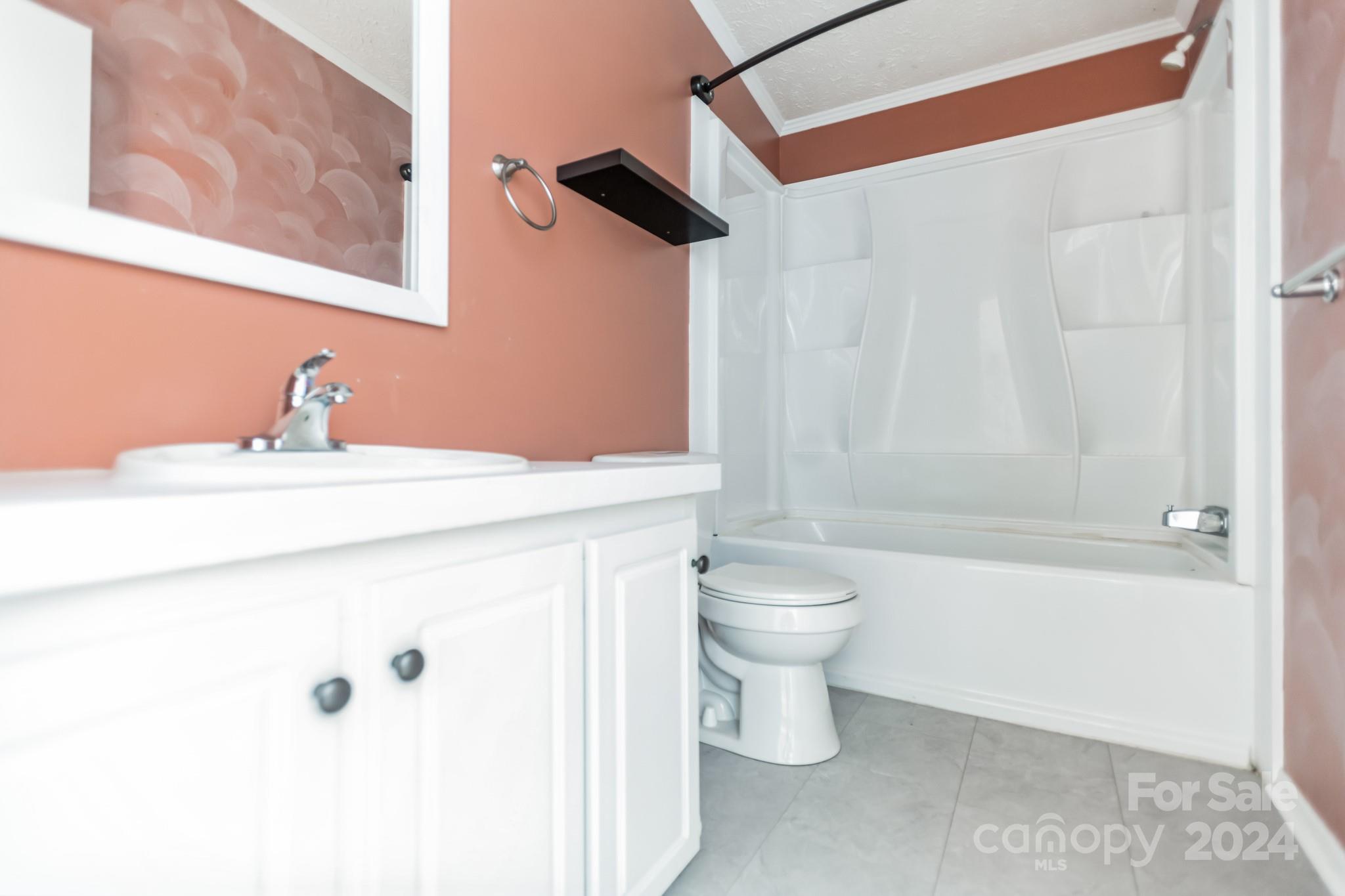 104 Cane Crest Circle Fairview, NC 28730 - Photo 18 of 29 a bathroom with a sink a toilet and shower