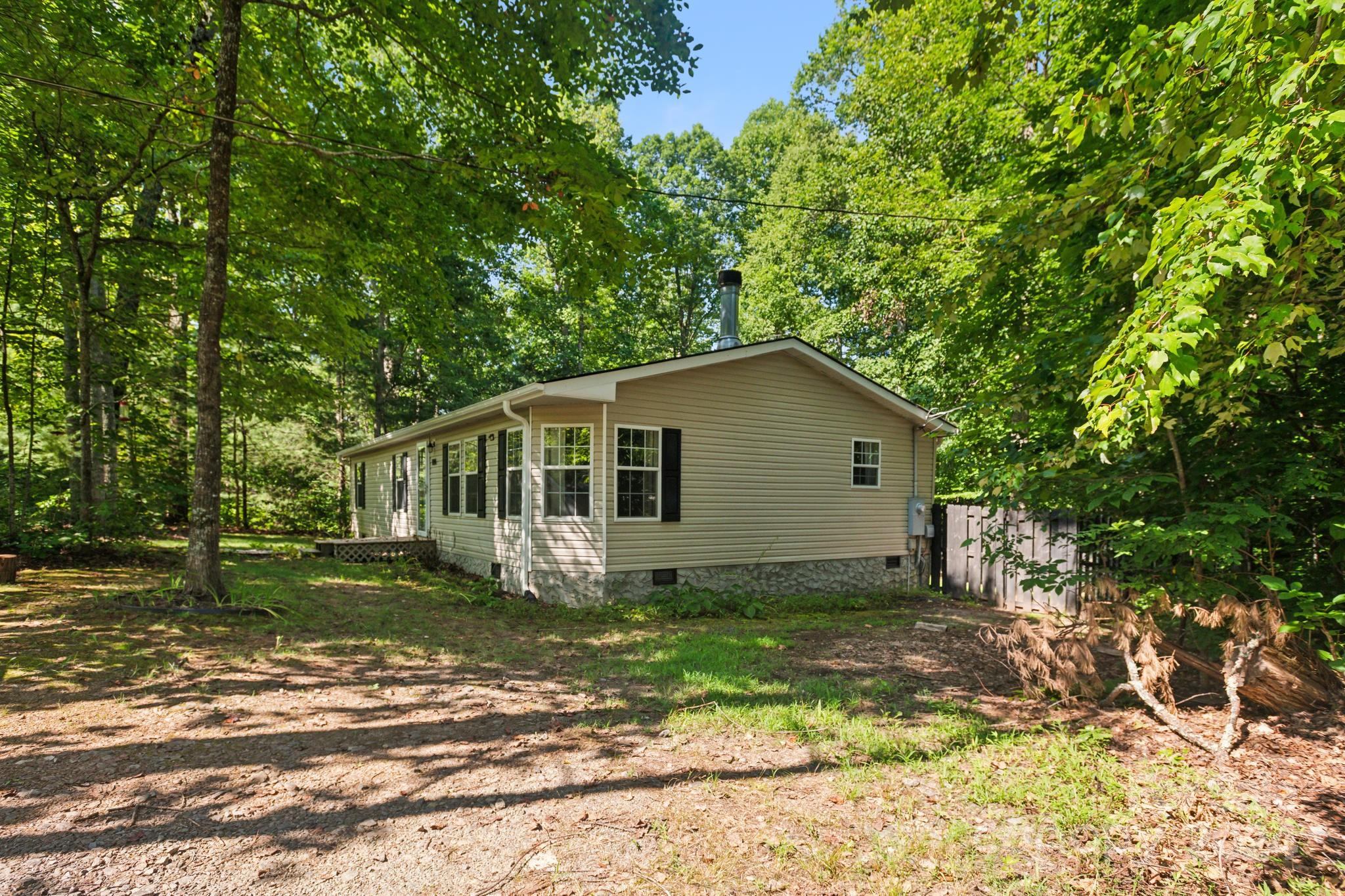 104 Cane Crest Circle Fairview, NC 28730 - Photo 2 of 29 a house with trees in the background
