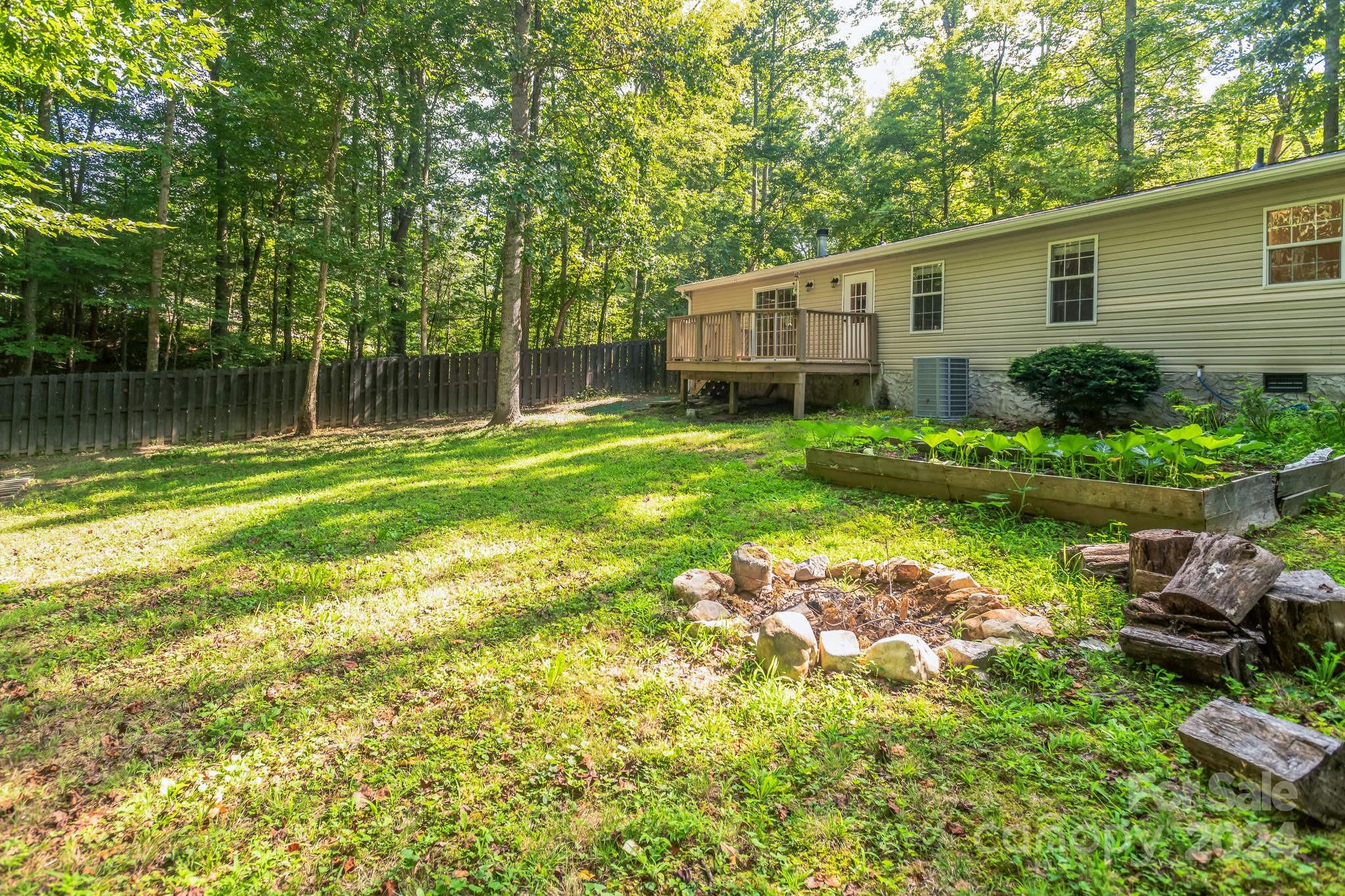 104 Cane Crest Circle Fairview, NC 28730 - Photo 22 of 29 a front view of a house with garden