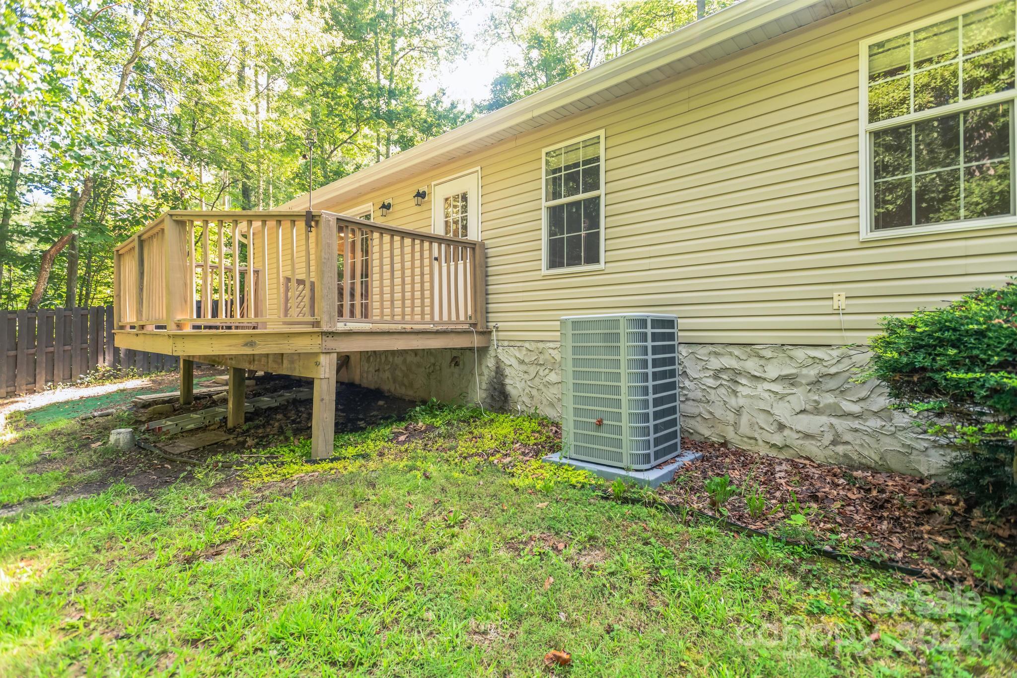 104 Cane Crest Circle Fairview, NC 28730 - Photo 25 of 29 a backyard of a house with table and chairs