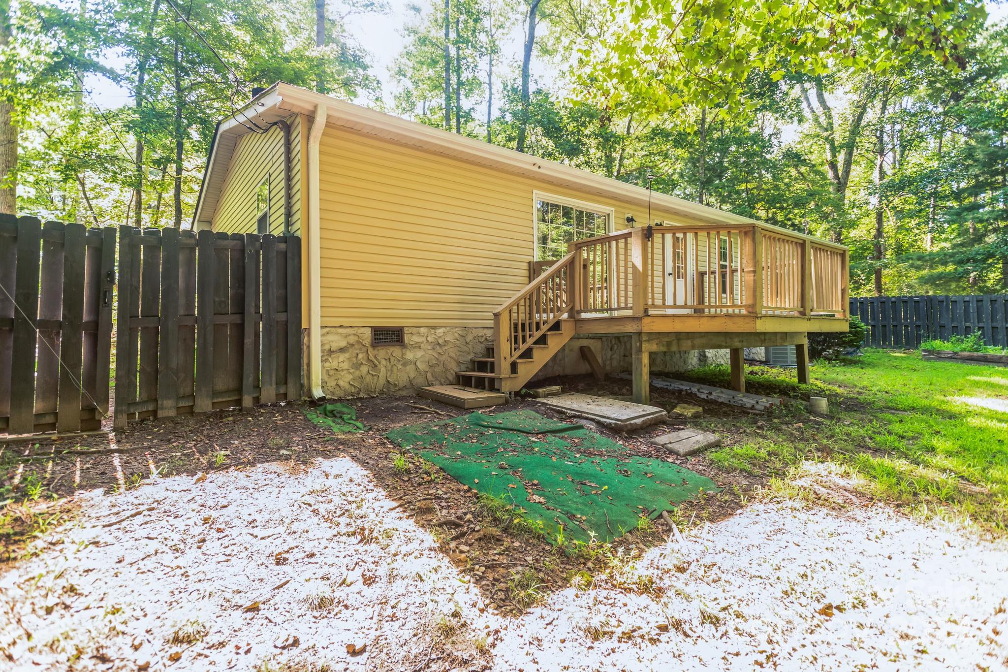 104 Cane Crest Circle Fairview, NC 28730 - Photo 26 of 29 a view of a house with backyard and sitting area