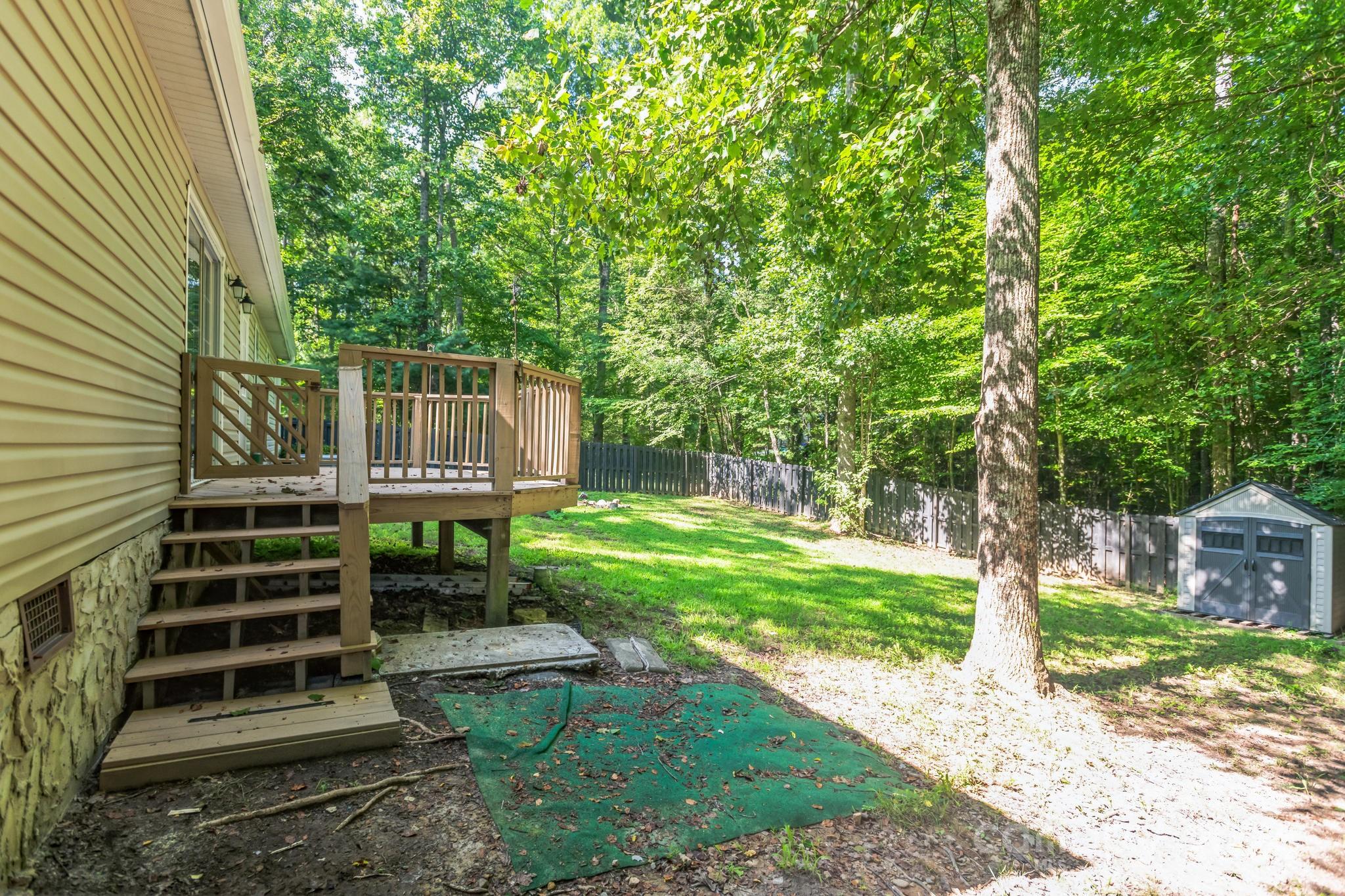 104 Cane Crest Circle Fairview, NC 28730 - Photo 27 of 29 a view of a chair and table in the backyard