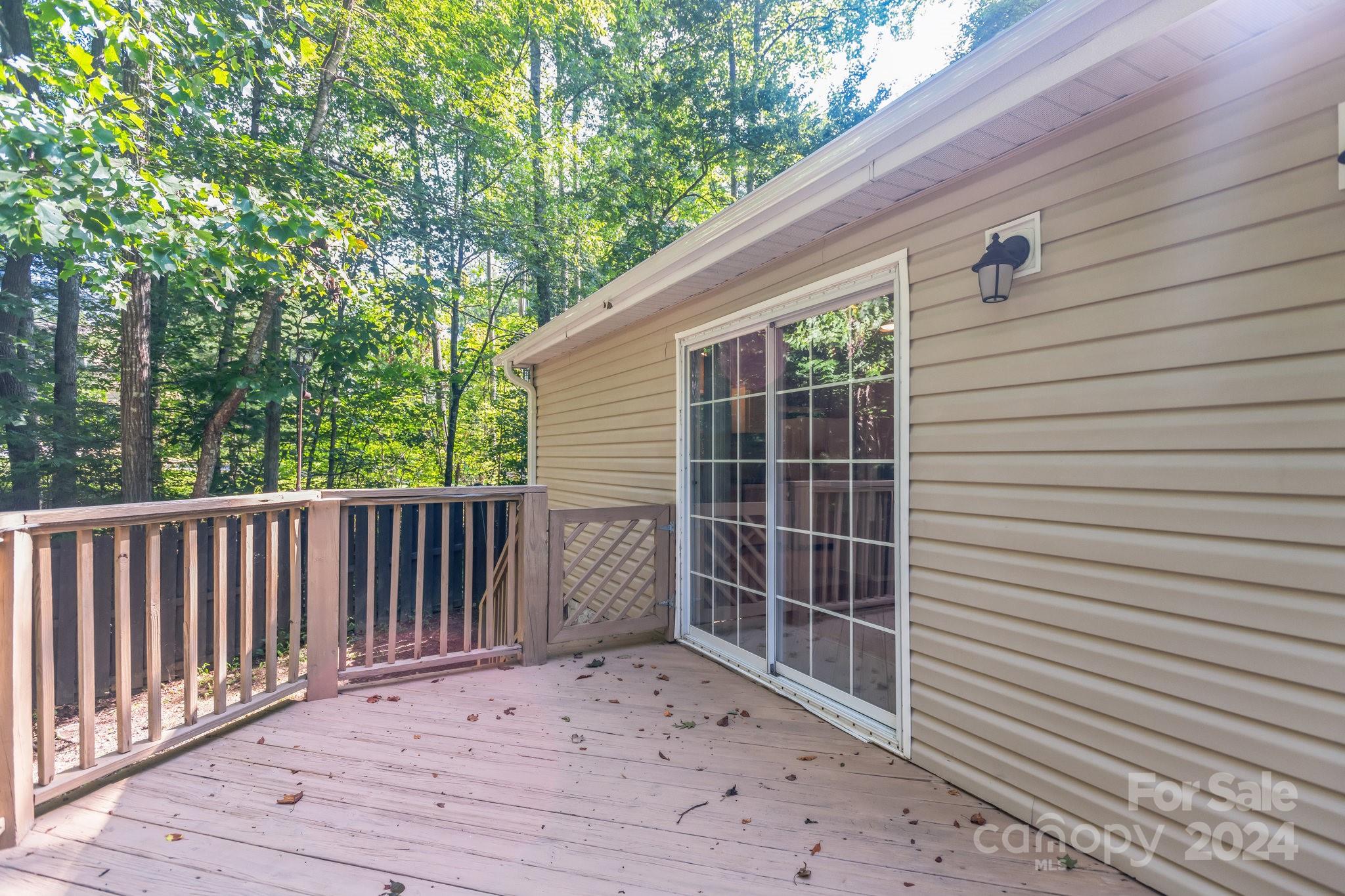 104 Cane Crest Circle Fairview, NC 28730 - Photo 28 of 29 a view of backyard with a deck and wooden fence