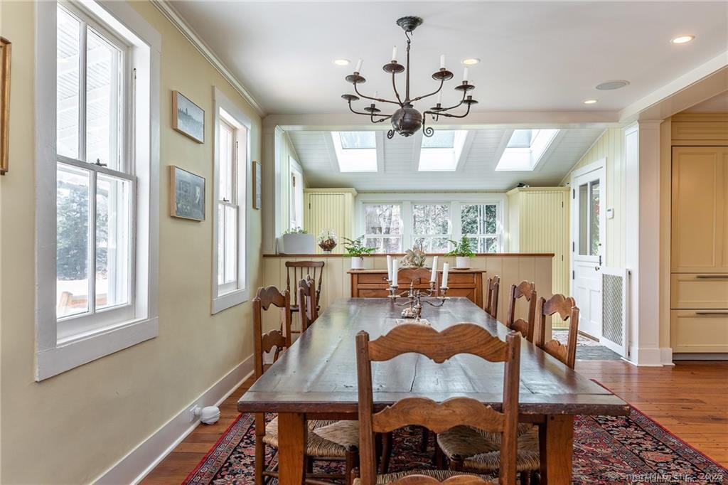 32 Leach Hollow Road Sherman, CT 06784 - Photo 14 of 40 a view of a dining room with furniture window and wooden floor