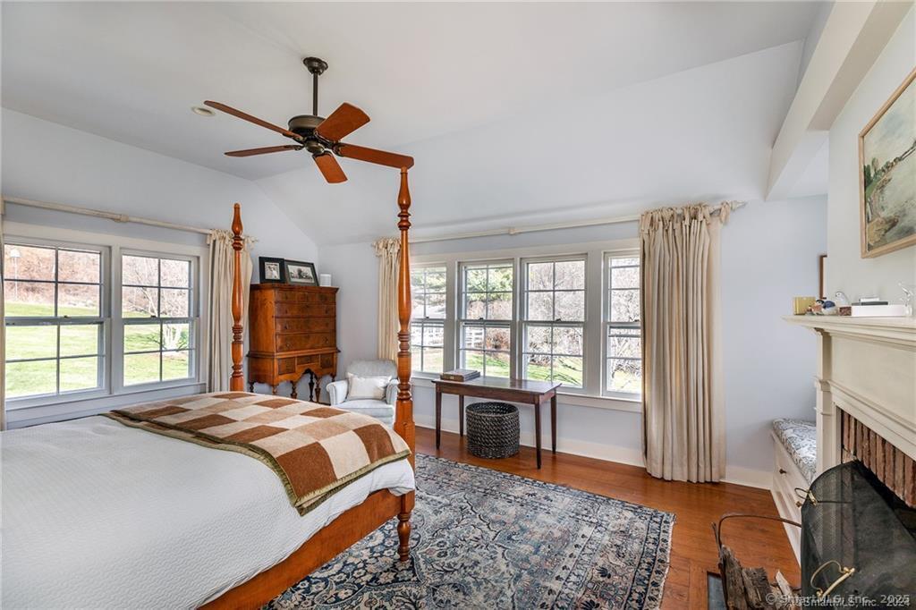 32 Leach Hollow Road Sherman, CT 06784 - Photo 17 of 40 a bedroom with a bed and a couch