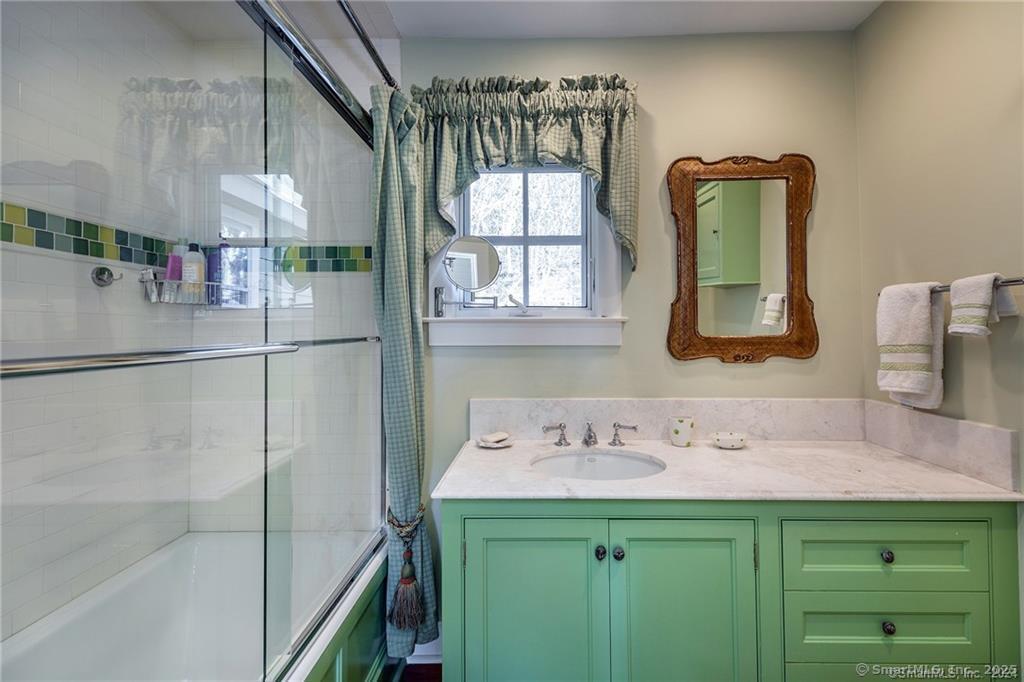 32 Leach Hollow Road Sherman, CT 06784 - Photo 20 of 40 a bathroom with a sink and a mirror