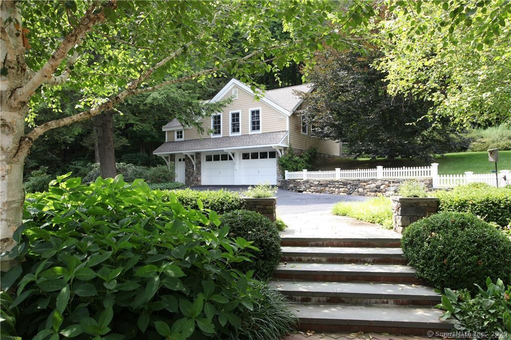 32 Leach Hollow Road Sherman, CT 06784 - Photo 24 of 40 a front view of a house with a yard