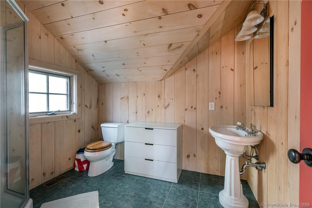 32 Leach Hollow Road Sherman, CT 06784 - Photo 28 of 40 a bathroom with a sink mirror toilet and bathtub