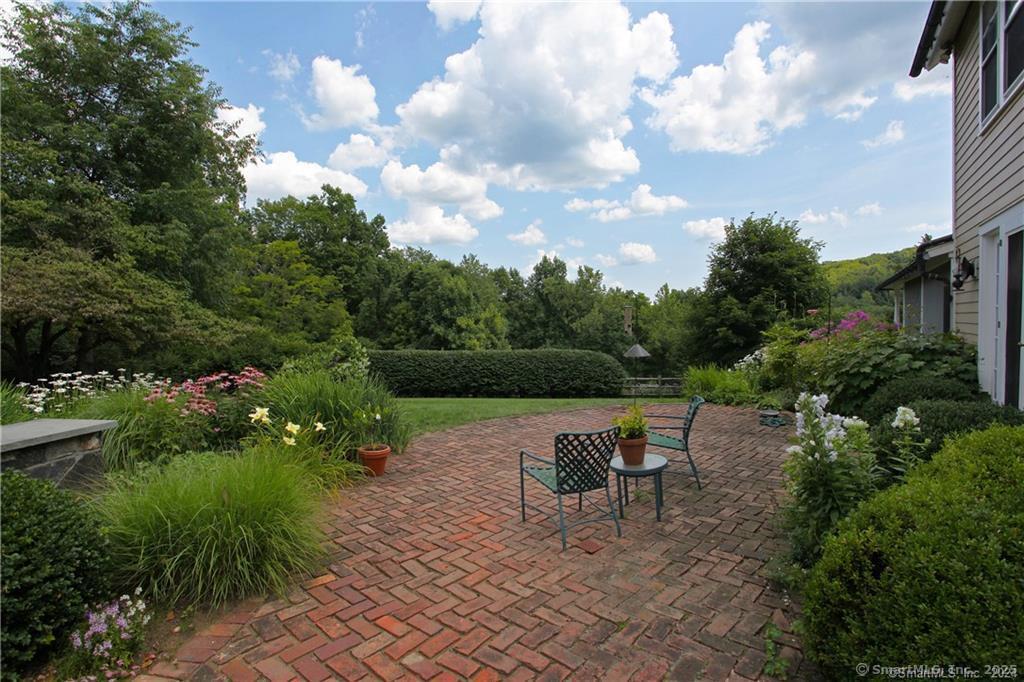 32 Leach Hollow Road Sherman, CT 06784 - Photo 31 of 40 a view of a lake with outdoor seating space