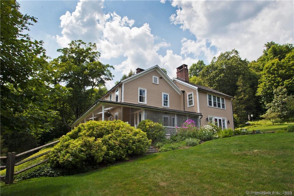 32 Leach Hollow Road Sherman, CT 06784 - Photo 37 of 40 a front view of a house with garden