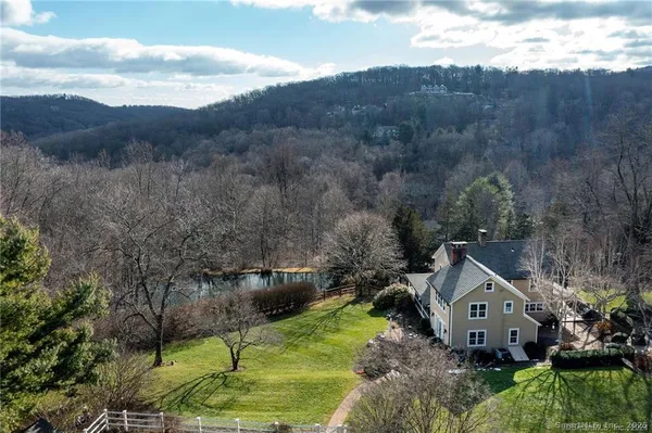 a aerial view of a house with a yard