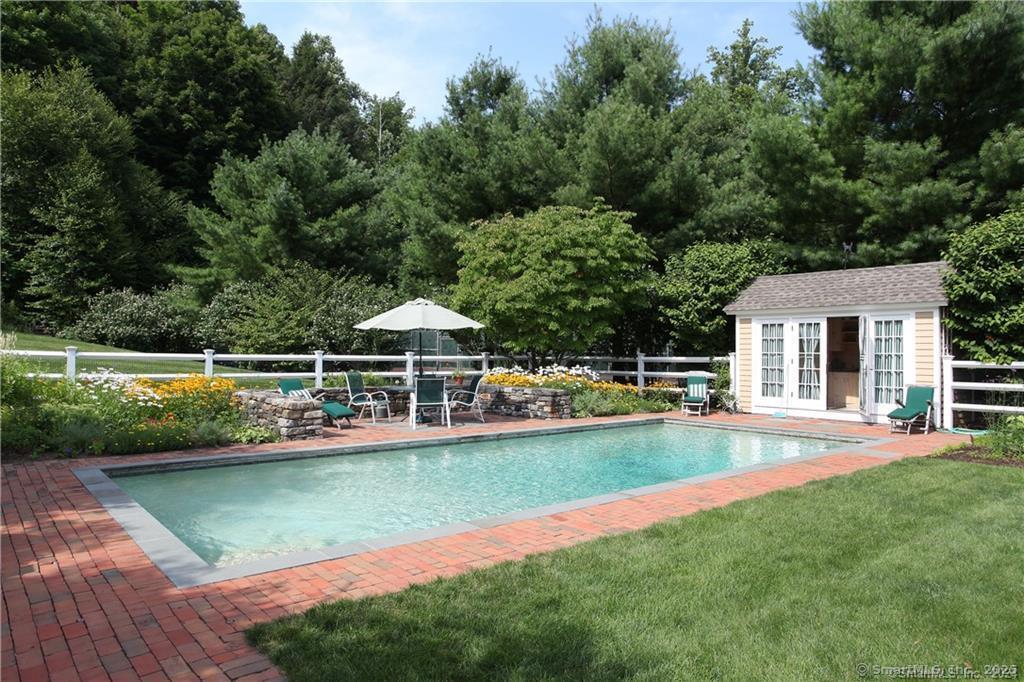 32 Leach Hollow Road Sherman, CT 06784 - Photo 5 of 40 a view of a house with swimming pool and sitting area