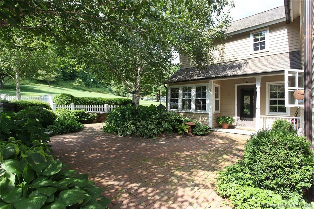 32 Leach Hollow Road Sherman, CT 06784 - Photo 6 of 40 a view of a house with a garden