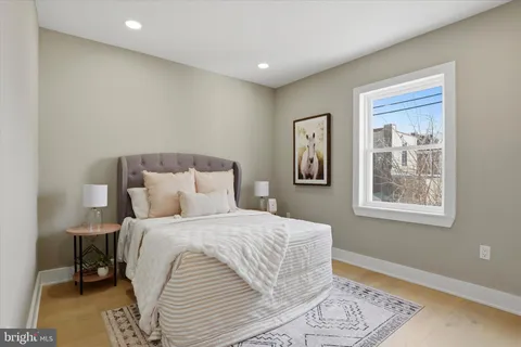a bedroom with a bed and a bathroom