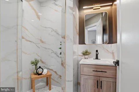 a bathroom with a bathtub and shower