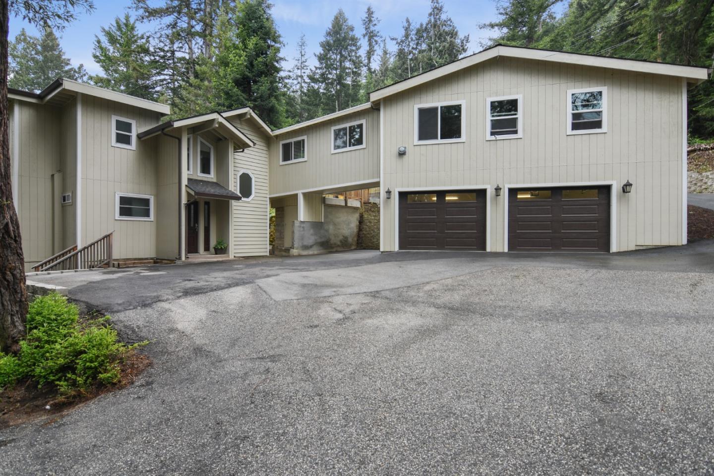 a view of a house with a yard and garage