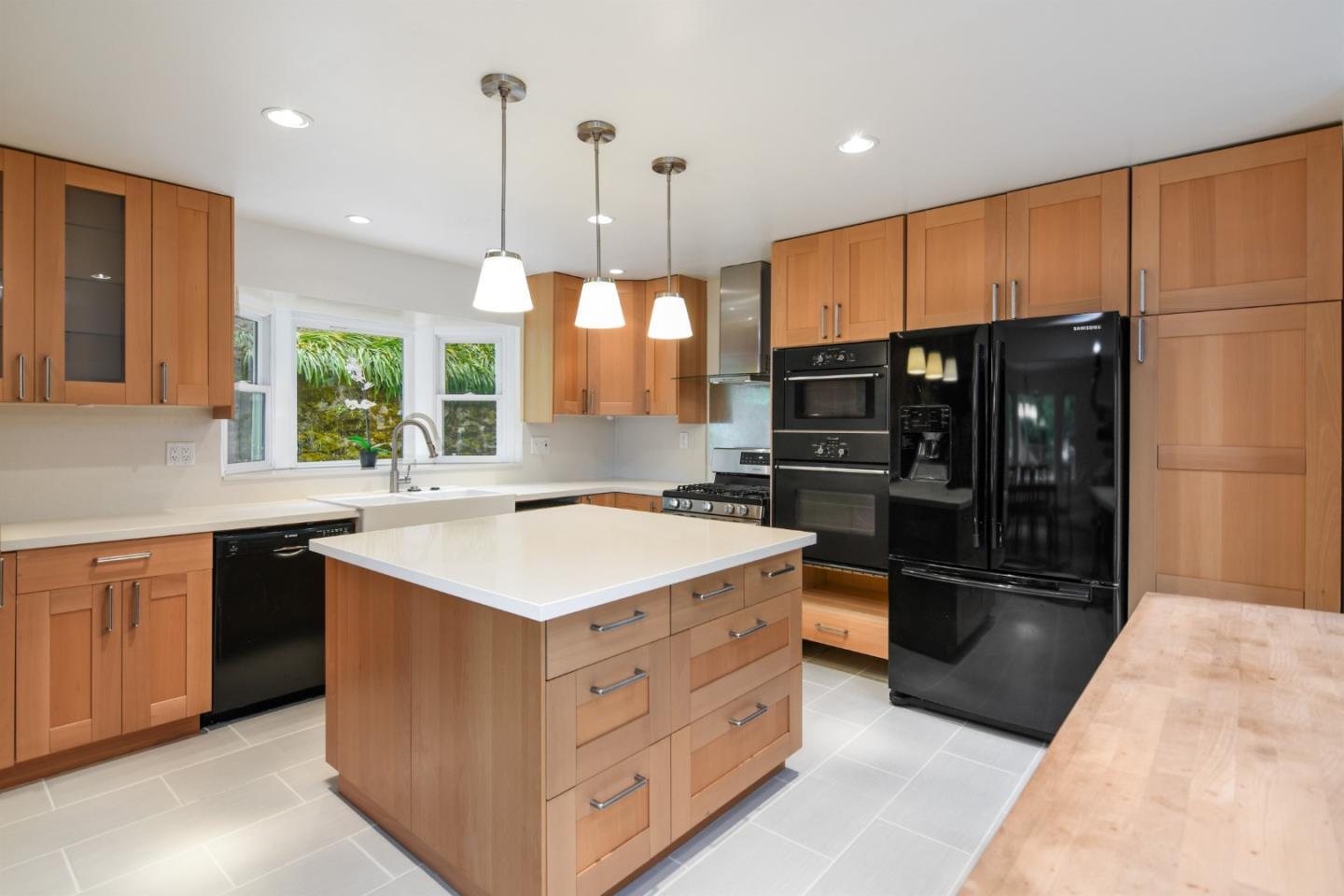 144 Eagle Crest Drive Scotts Valley, CA 95066 - Photo 11 of 28 a kitchen with stainless steel appliances granite countertop a refrigerator a sink a stove and a microwave