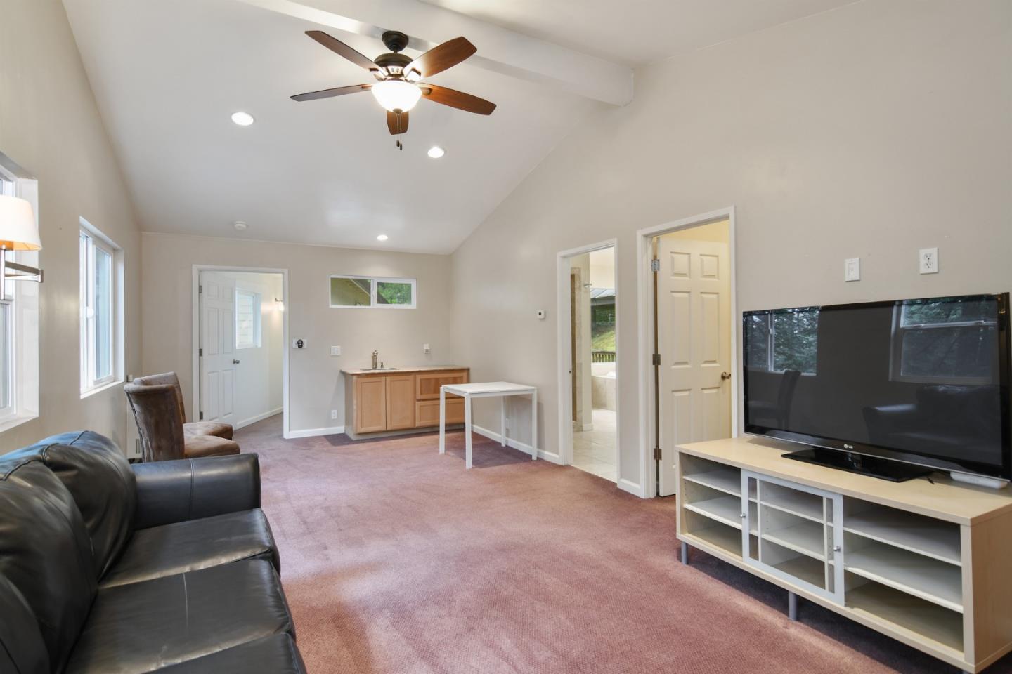 144 Eagle Crest Drive Scotts Valley, CA 95066 - Photo 15 of 28 a living room with furniture and a flat screen tv