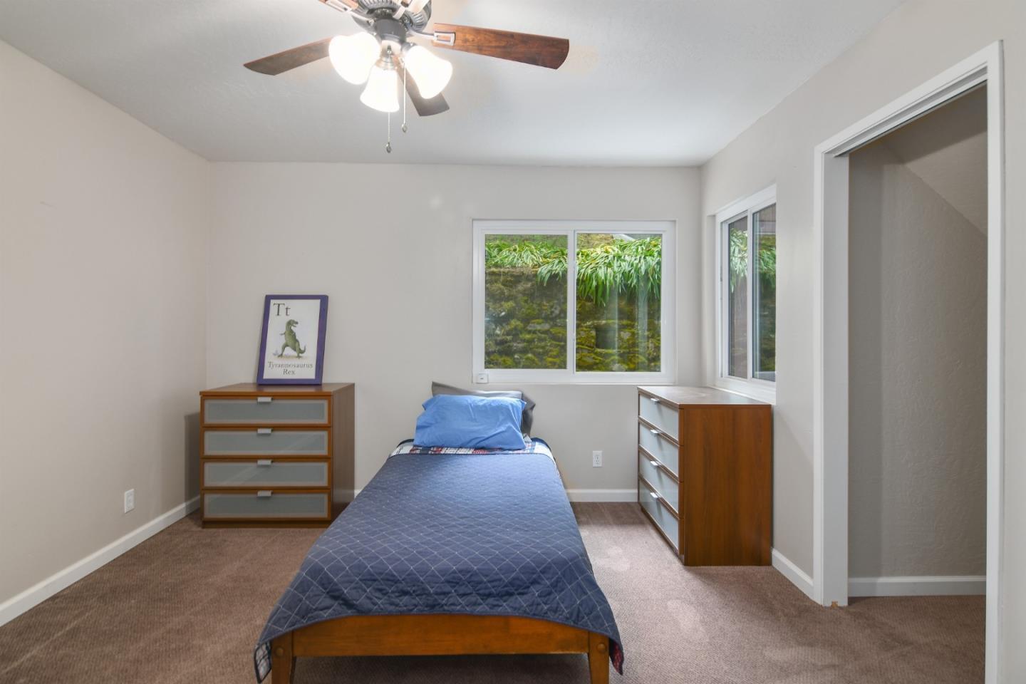 144 Eagle Crest Drive Scotts Valley, CA 95066 - Photo 16 of 28 a bed room with a bed and a window