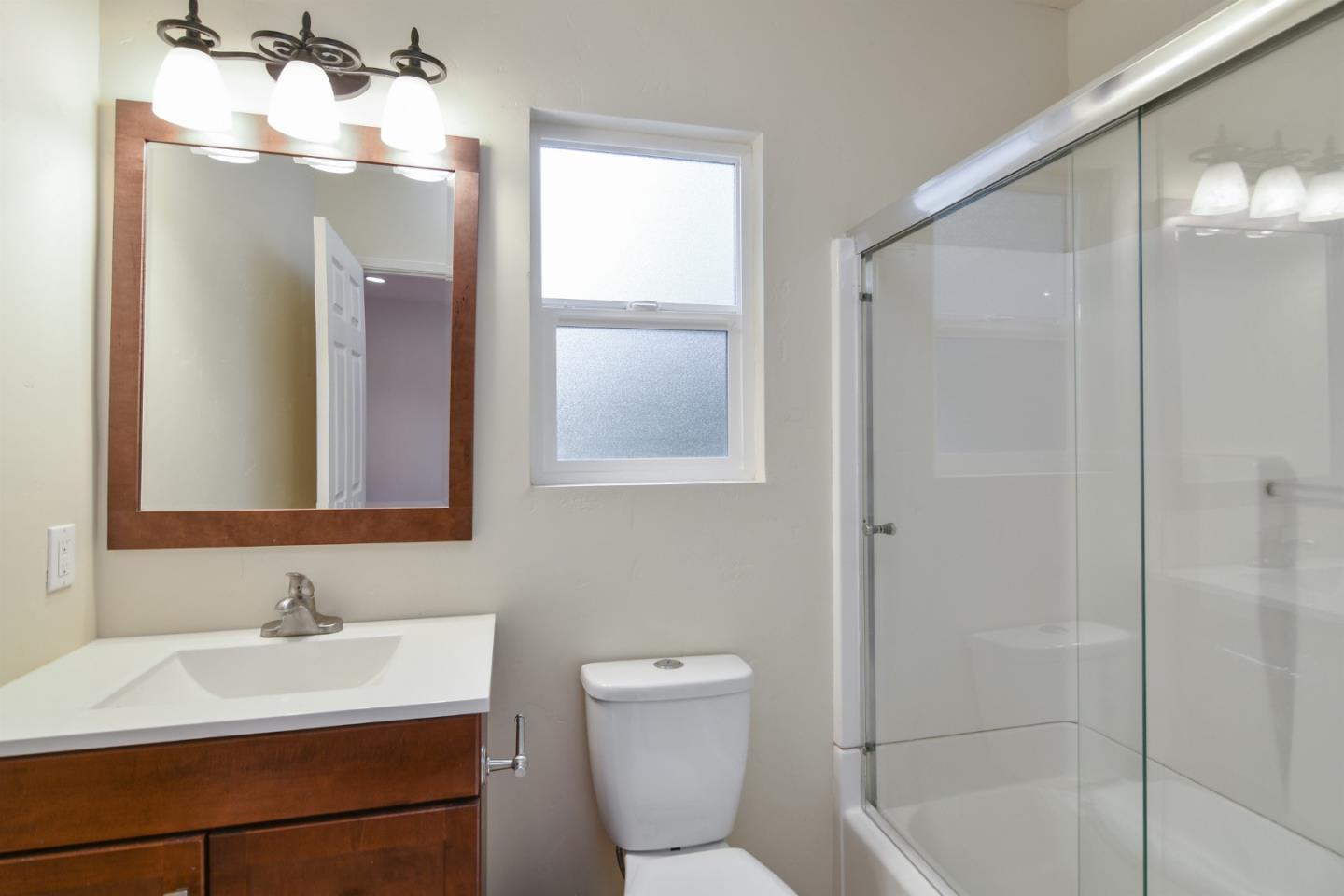 144 Eagle Crest Drive Scotts Valley, CA 95066 - Photo 19 of 28 a bathroom with a sink toilet and shower