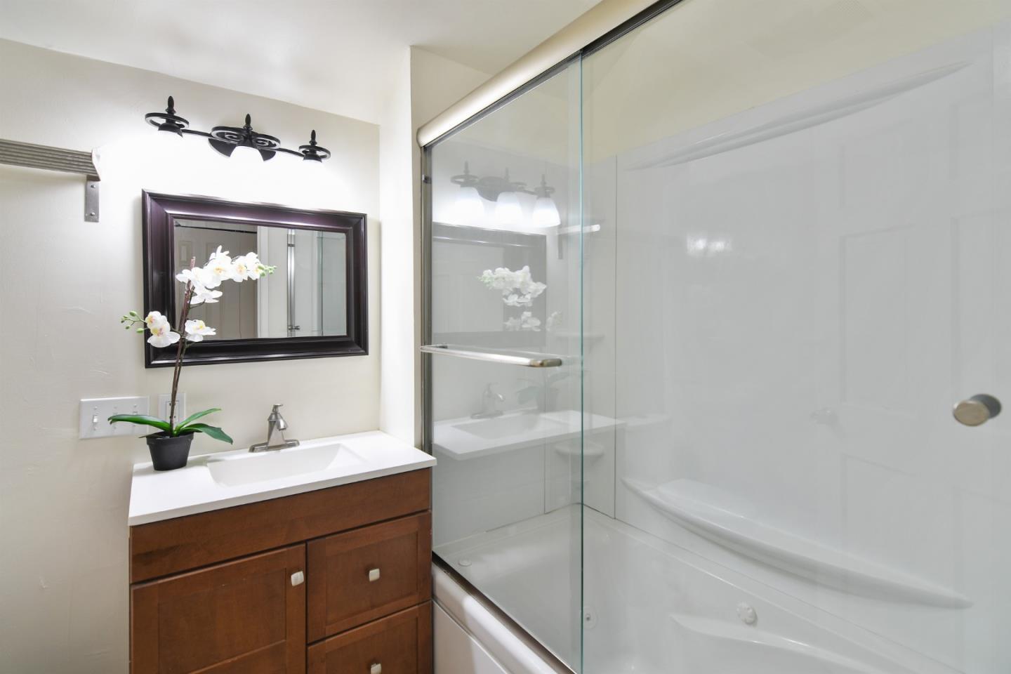 144 Eagle Crest Drive Scotts Valley, CA 95066 - Photo 21 of 28 a bathroom with a bathtub shower sink and mirror