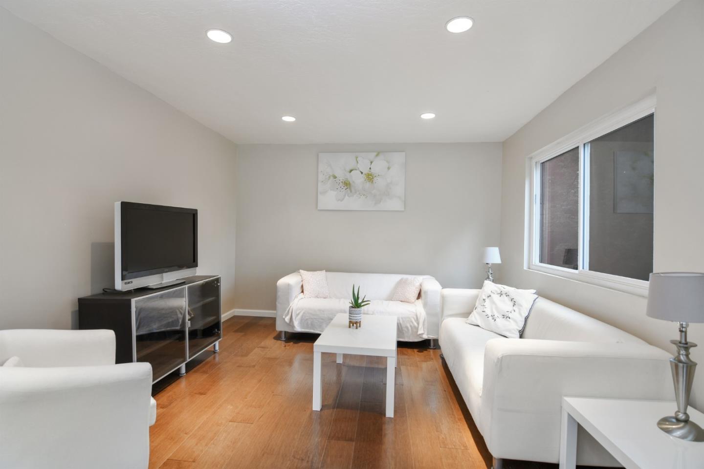 144 Eagle Crest Drive Scotts Valley, CA 95066 - Photo 8 of 28 a living room with furniture and a flat screen tv