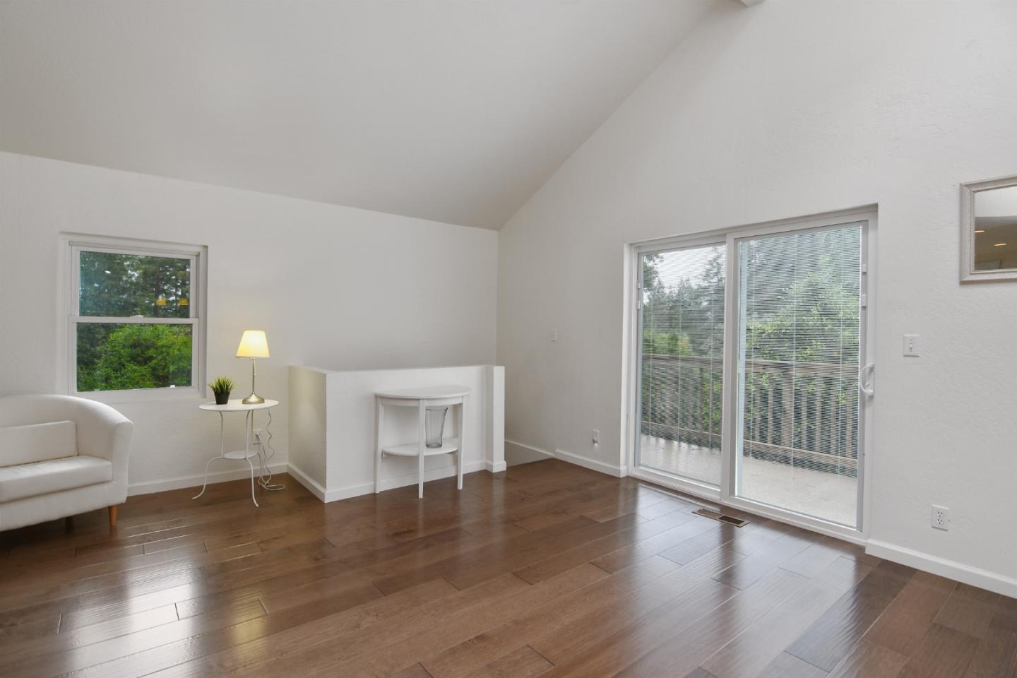 144 Eagle Crest Drive Scotts Valley, CA 95066 - Photo 9 of 28 a view of empty room with wooden floor and fan