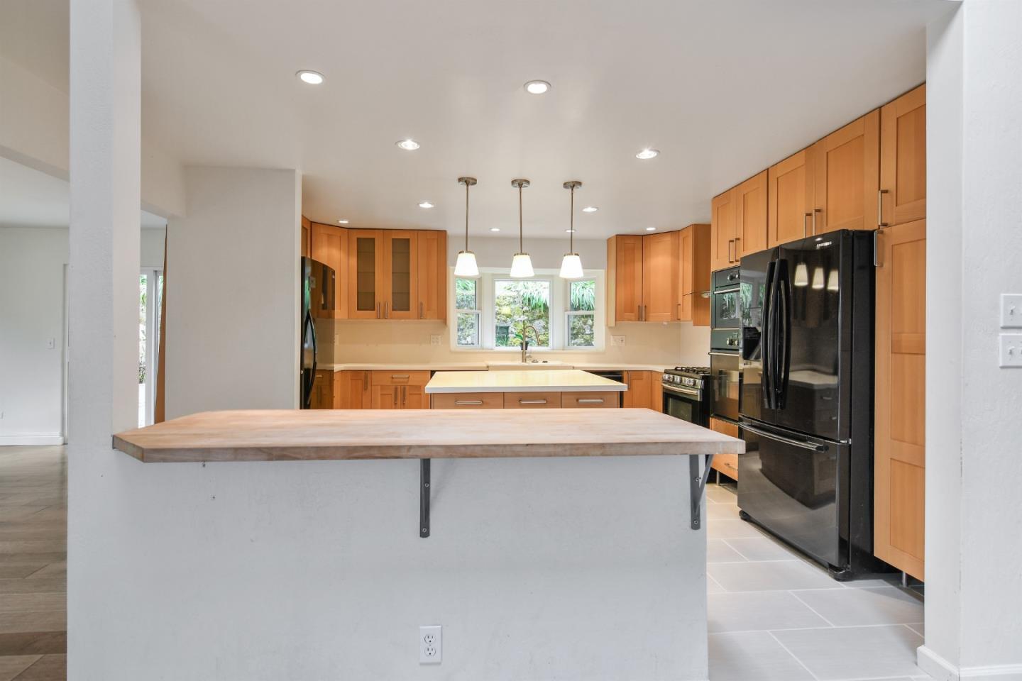 144 Eagle Crest Drive Scotts Valley, CA 95066 - Photo 10 of 28 a kitchen with stainless steel appliances a refrigerator and a stove