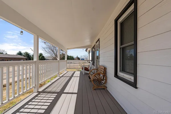 a view of balcony with wooden floor
