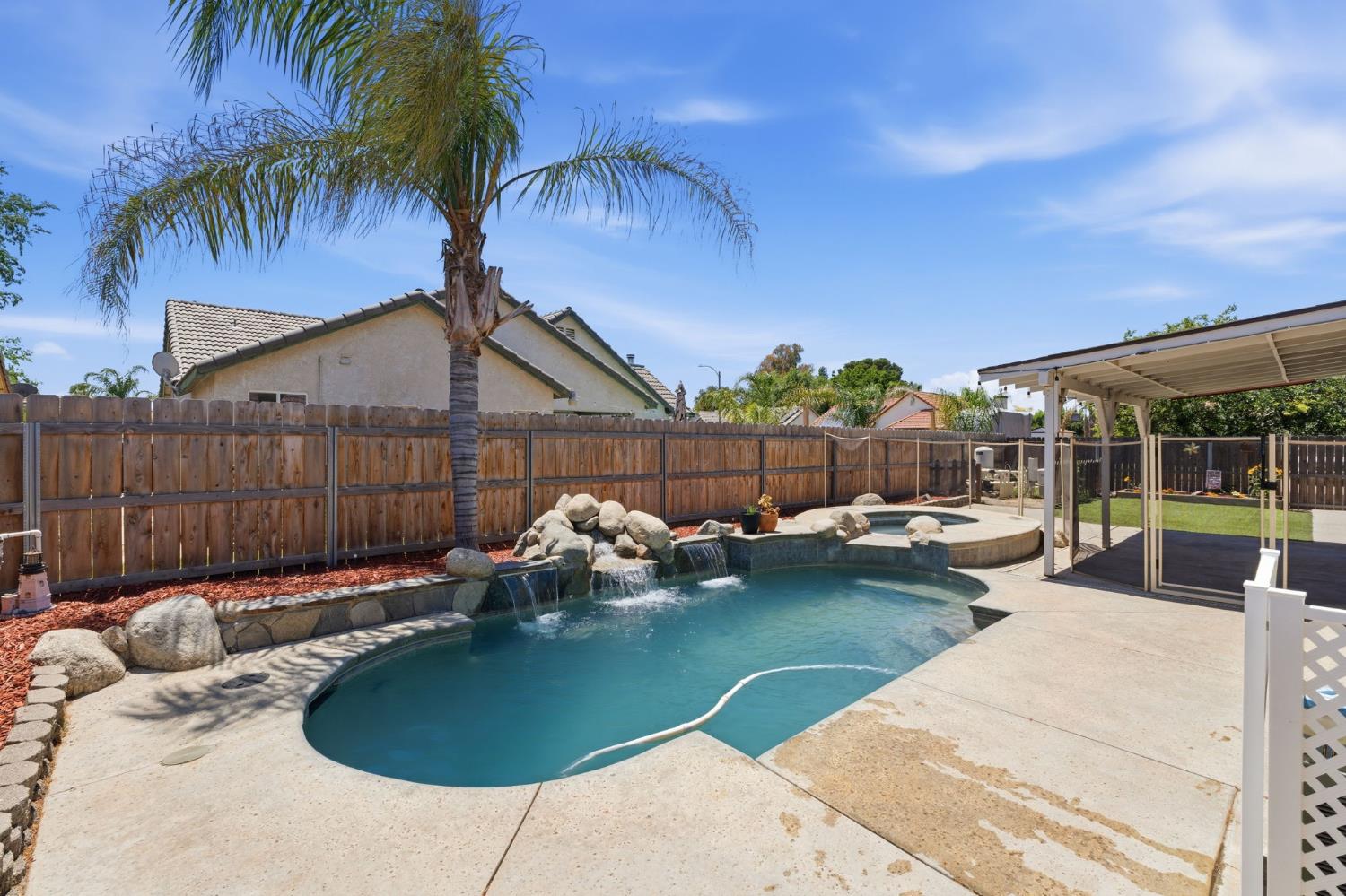 1757 Homestead Way Lemoore, CA 93245 - Photo 27 of 35 a backyard of a house with table and chairs