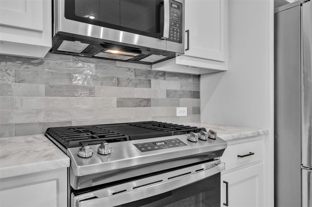2004 Willy Dilly Road Springtown, TX 76082 - Photo 15 of 40 Stainless steel gas range with a coordinating microwave oven and range hood