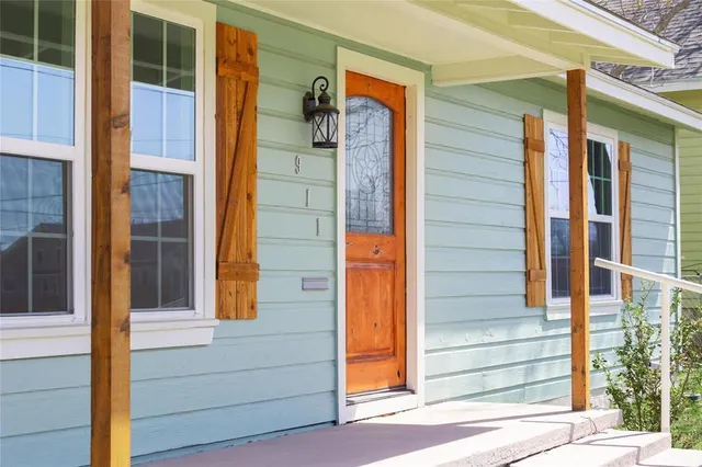 a view of front door of house with stairs