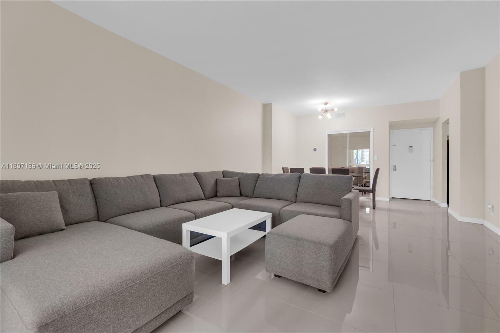 a living room with furniture and a couch