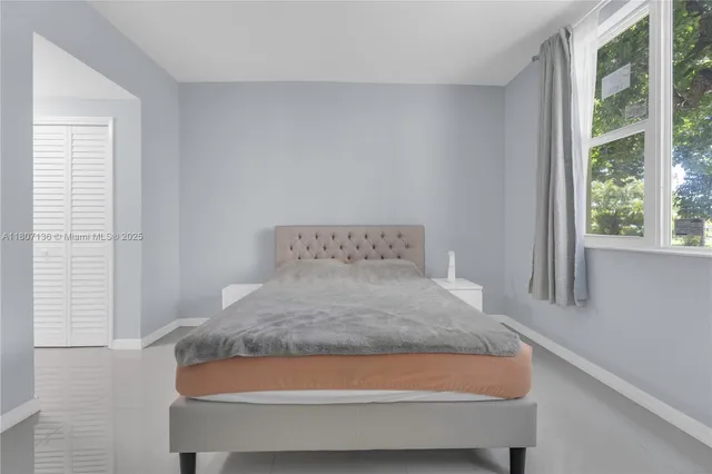 a room with a bed and a window