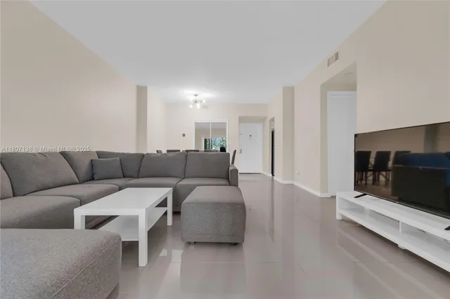 a living room with furniture and a couch