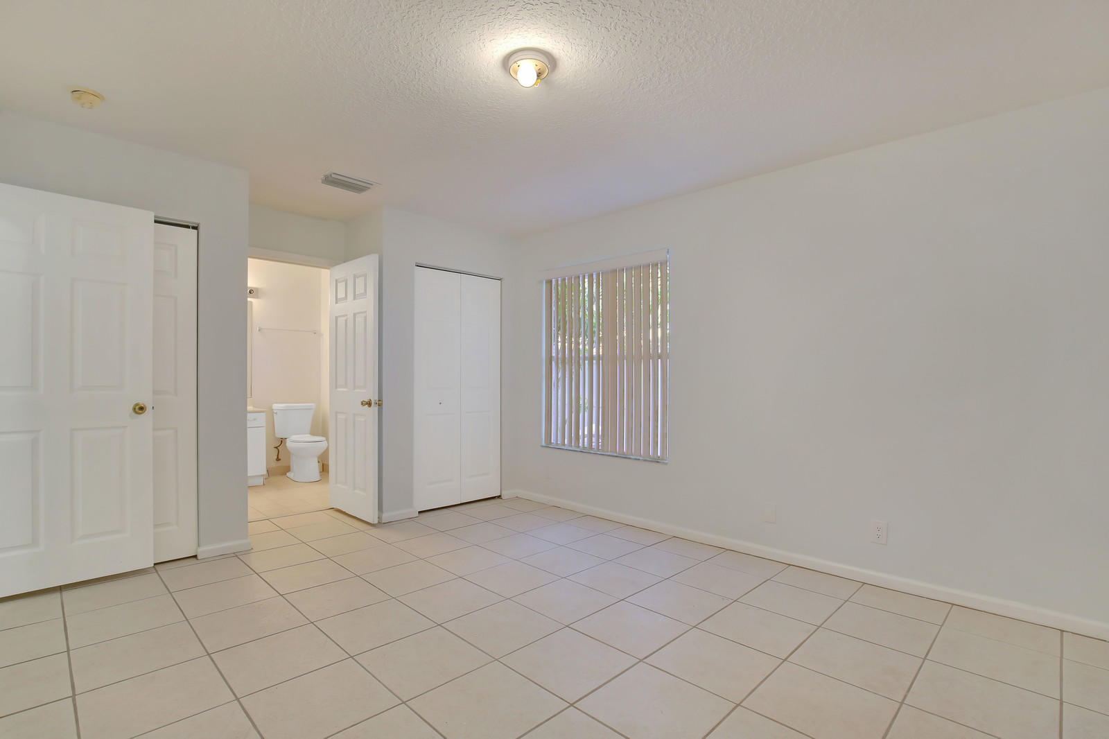 299 Palm Avenue Jupiter, FL 33477 - Photo 15 of 26 a view of an empty room and window