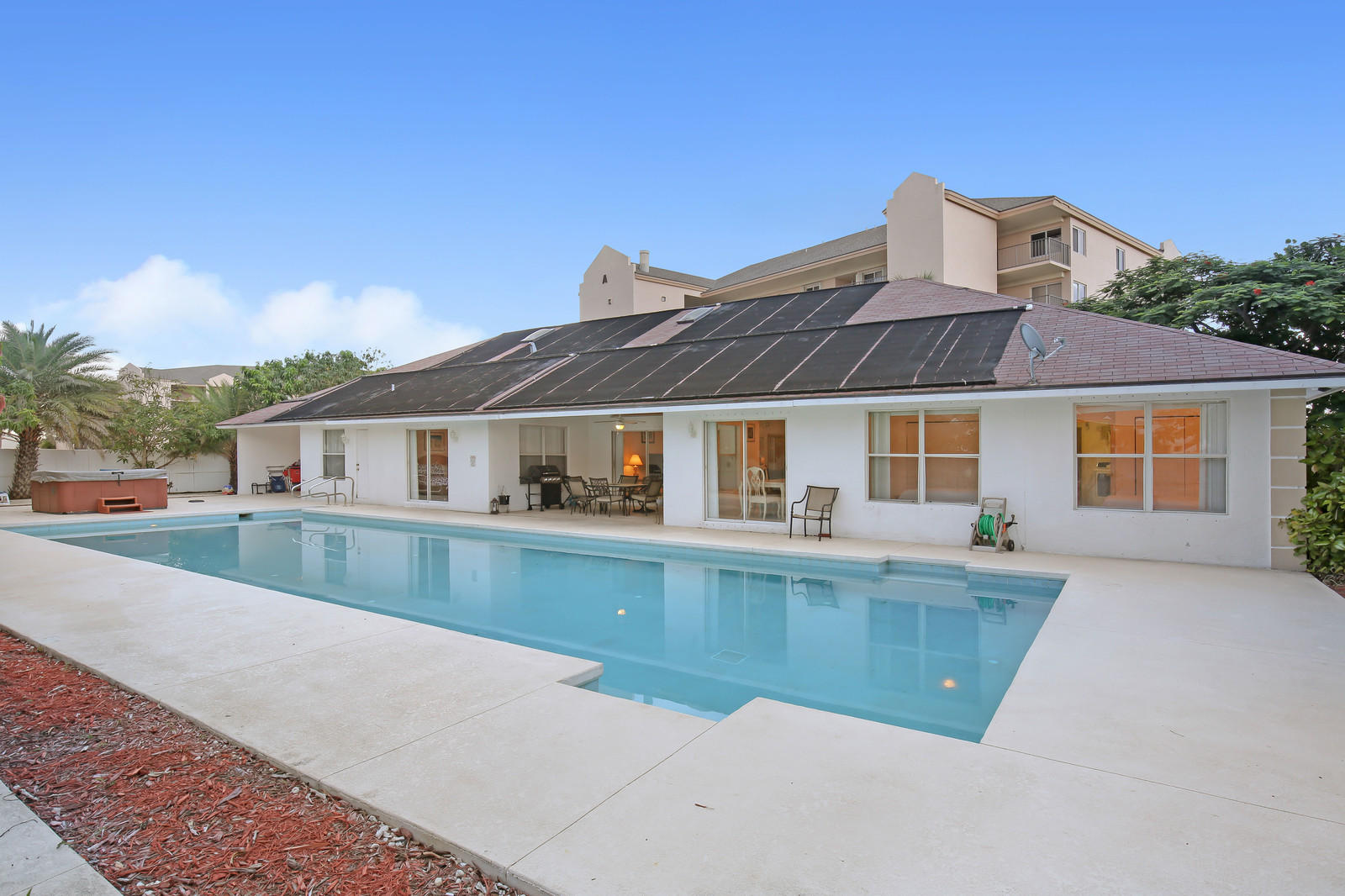 299 Palm Avenue Jupiter, FL 33477 - Photo 17 of 26 a front view of house with yard