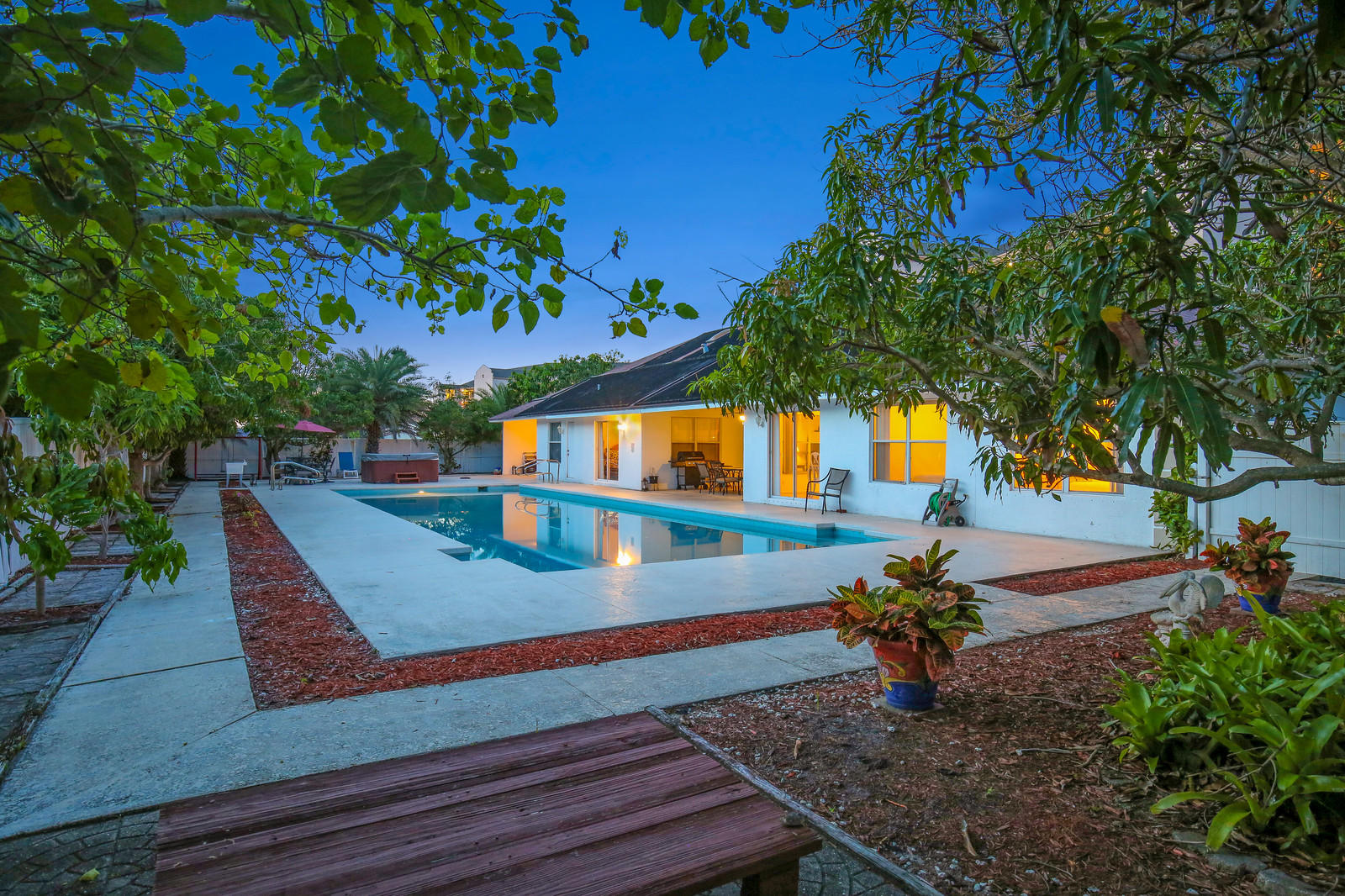 299 Palm Avenue Jupiter, FL 33477 - Photo 21 of 26 a front view of a house with a yard