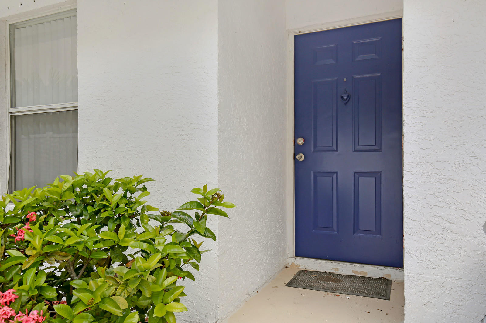 299 Palm Avenue Jupiter, FL 33477 - Photo 5 of 26 a view of door with yard