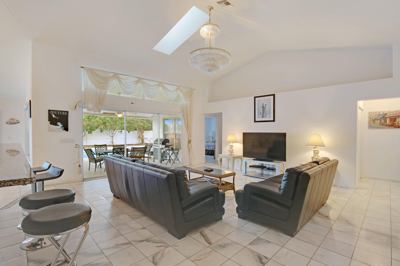 299 Palm Avenue Jupiter, FL 33477 - Photo 6 of 26 a living room with fireplace furniture and a flat screen tv